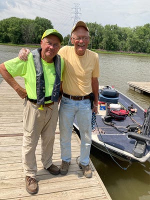 Gary Dahlquest, left, and Tom Simpson, both of Geneseo, recently ventured on the Mississippi River in search of channel cats. Dan Dauw
tagged along to fish and net the big ones.